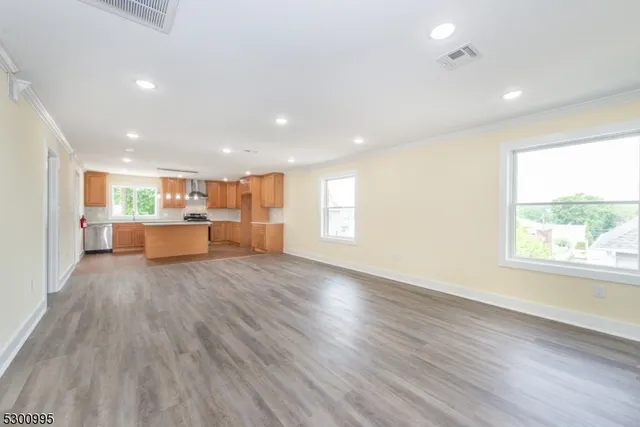 a view of a kitchen with a sink and a window