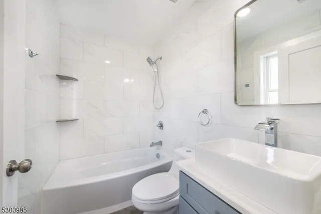 a bathroom with a sink a toilet and a bathtub