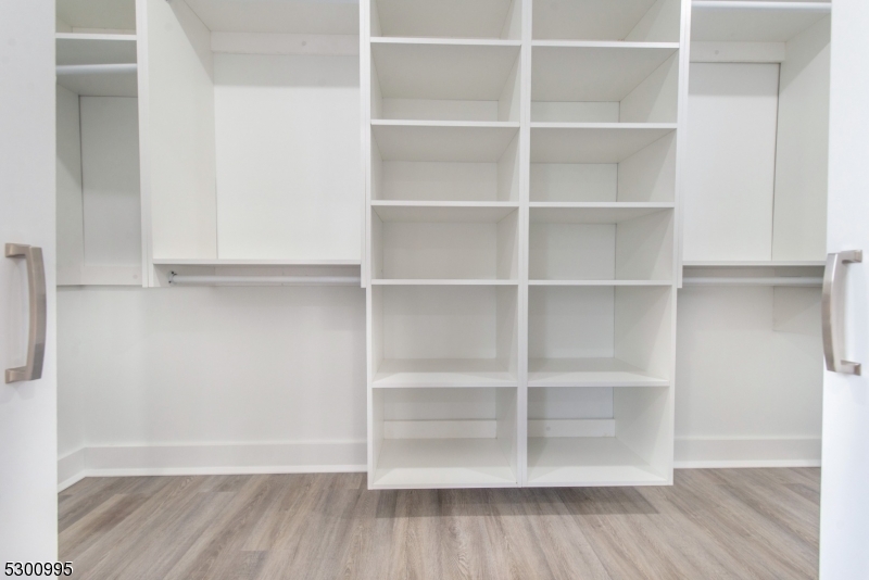 67 Harrison Street Nutley, NJ 07110 - Photo 9 of 20 a view of a room with shelf and wooden floor