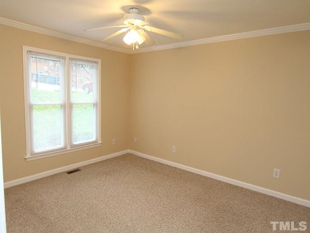 6800 Daltrey Court Raleigh, NC 27613 - Photo 7 of 12 an empty room with a window