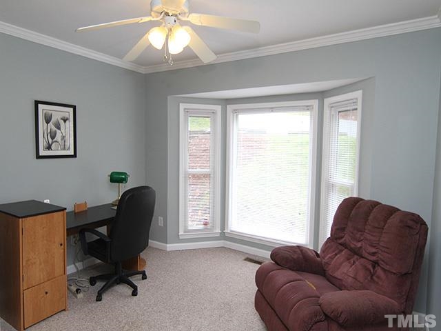 6800 Daltrey Court Raleigh, NC 27613 - Photo 9 of 12 a livingroom with workspace and a window