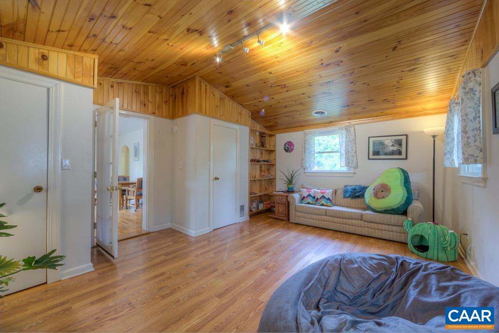 1935 Lambs Road Charlottesville, VA 22901 - Photo 12 of 24 a living room with furniture and wooden floor