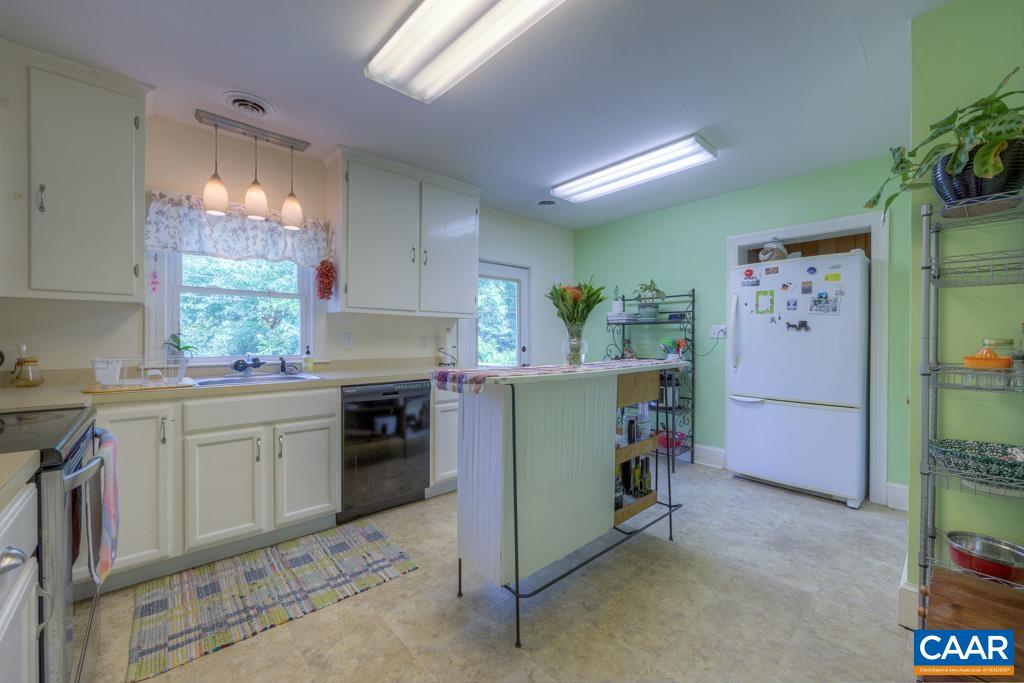 1935 Lambs Road Charlottesville, VA 22901 - Photo 14 of 24 a kitchen with a refrigerator and a stove top oven