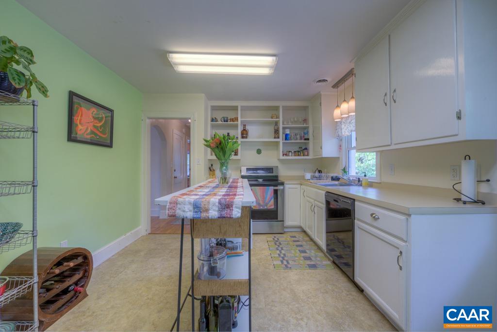 1935 Lambs Road Charlottesville, VA 22901 - Photo 15 of 24 a kitchen with cabinets and chairs