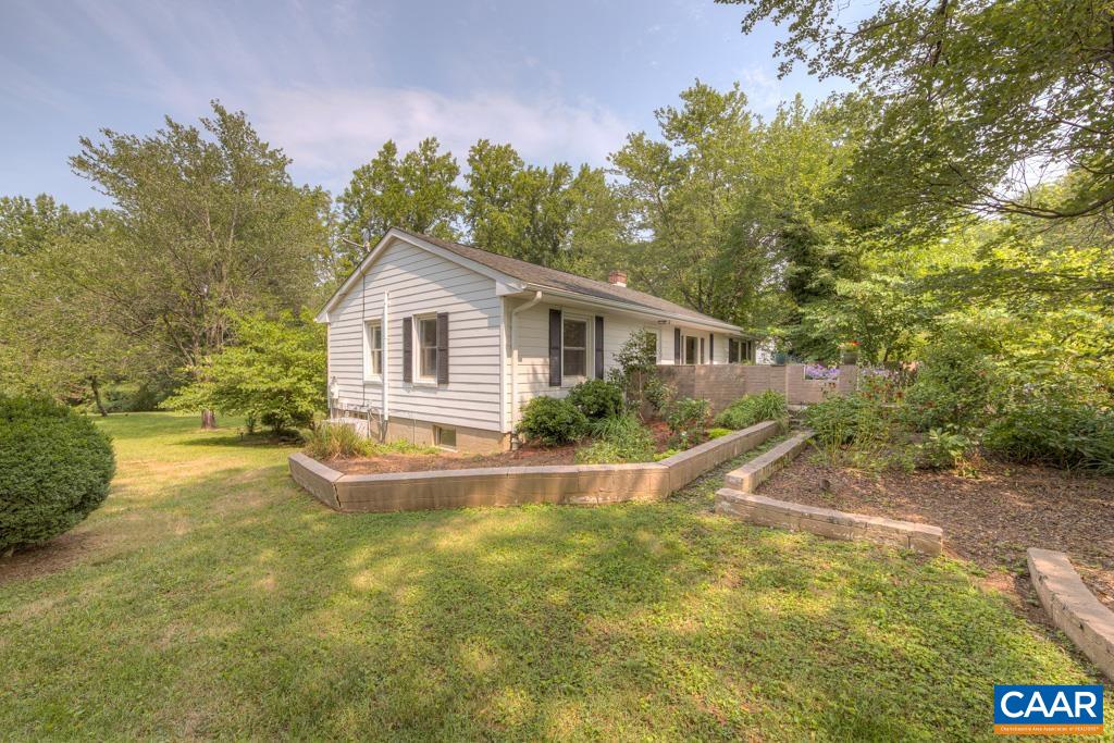 1935 Lambs Road Charlottesville, VA 22901 - Photo 3 of 24 a view of house with backyard and outdoor seating