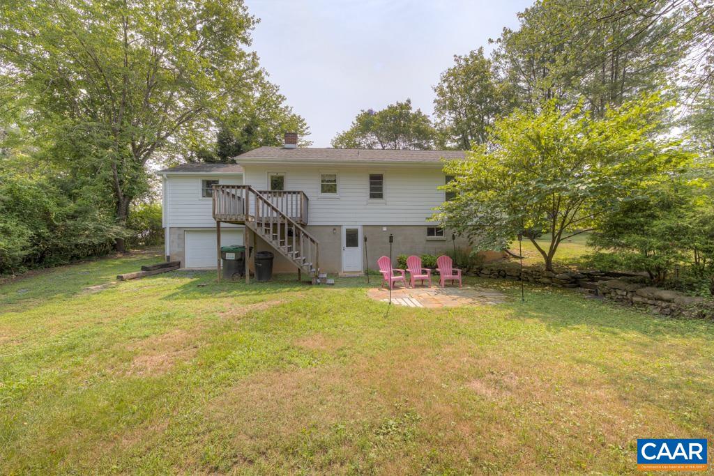 1935 Lambs Road Charlottesville, VA 22901 - Photo 4 of 24 a view of a house with backyard and chairs