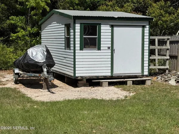 a view of backyard of house