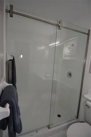 a bedroom with two beds and a window