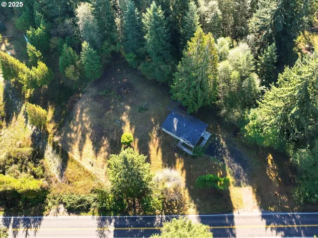 an aerial view of a house with a yard