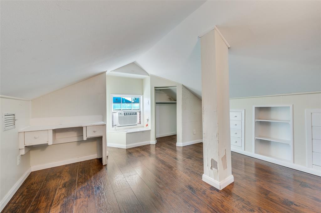 419 North Frances Street Dallas, TX 75211 - Photo 11 of 25 a view of empty room with wooden floor and window