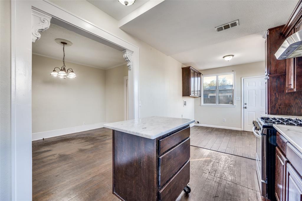 419 North Frances Street Dallas, TX 75211 - Photo 15 of 25 a view of kitchen with cabinets and wooden floor