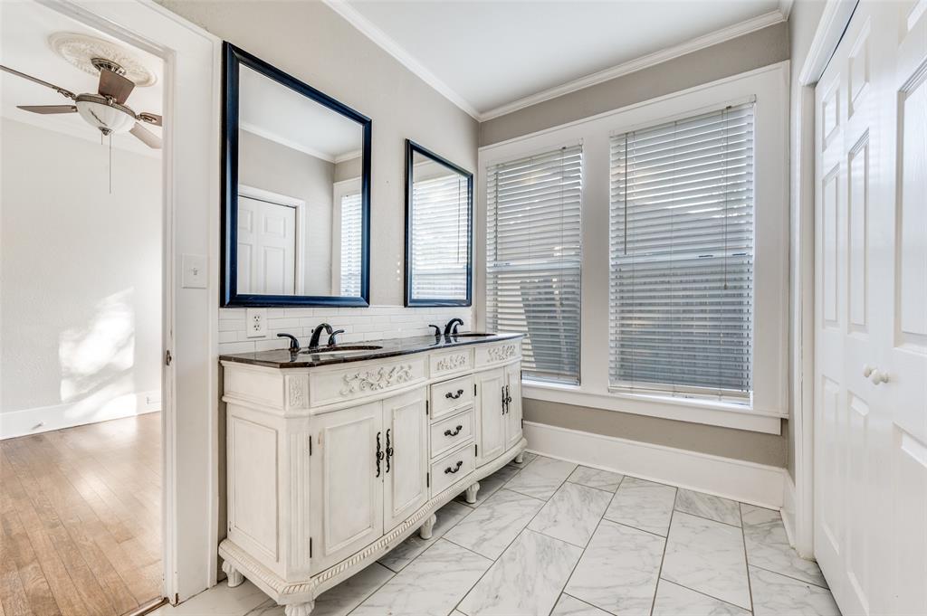 419 North Frances Street Dallas, TX 75211 - Photo 17 of 25 a bathroom with a granite countertop sink a mirror and a