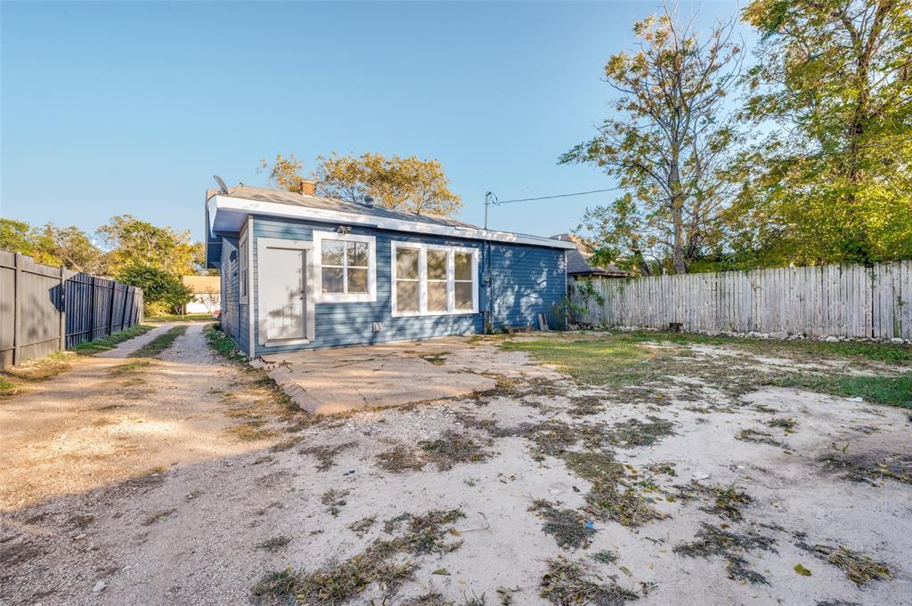 419 North Frances Street Dallas, TX 75211 - Photo 19 of 25 a view of a house with a yard