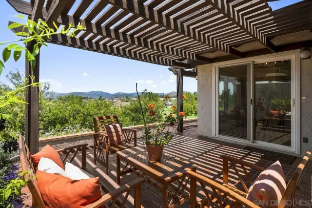 a view of a chairs and table in the patio