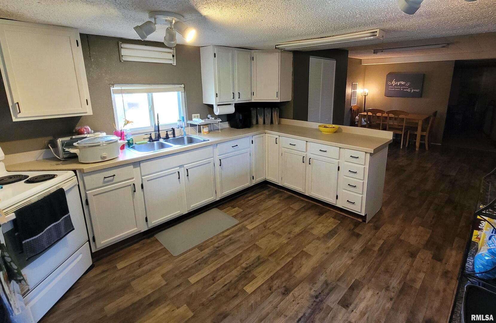 3993 Greenridge Road Alma, IL 62807 - Photo 11 of 45 a kitchen with granite countertop white cabinets and white appliances