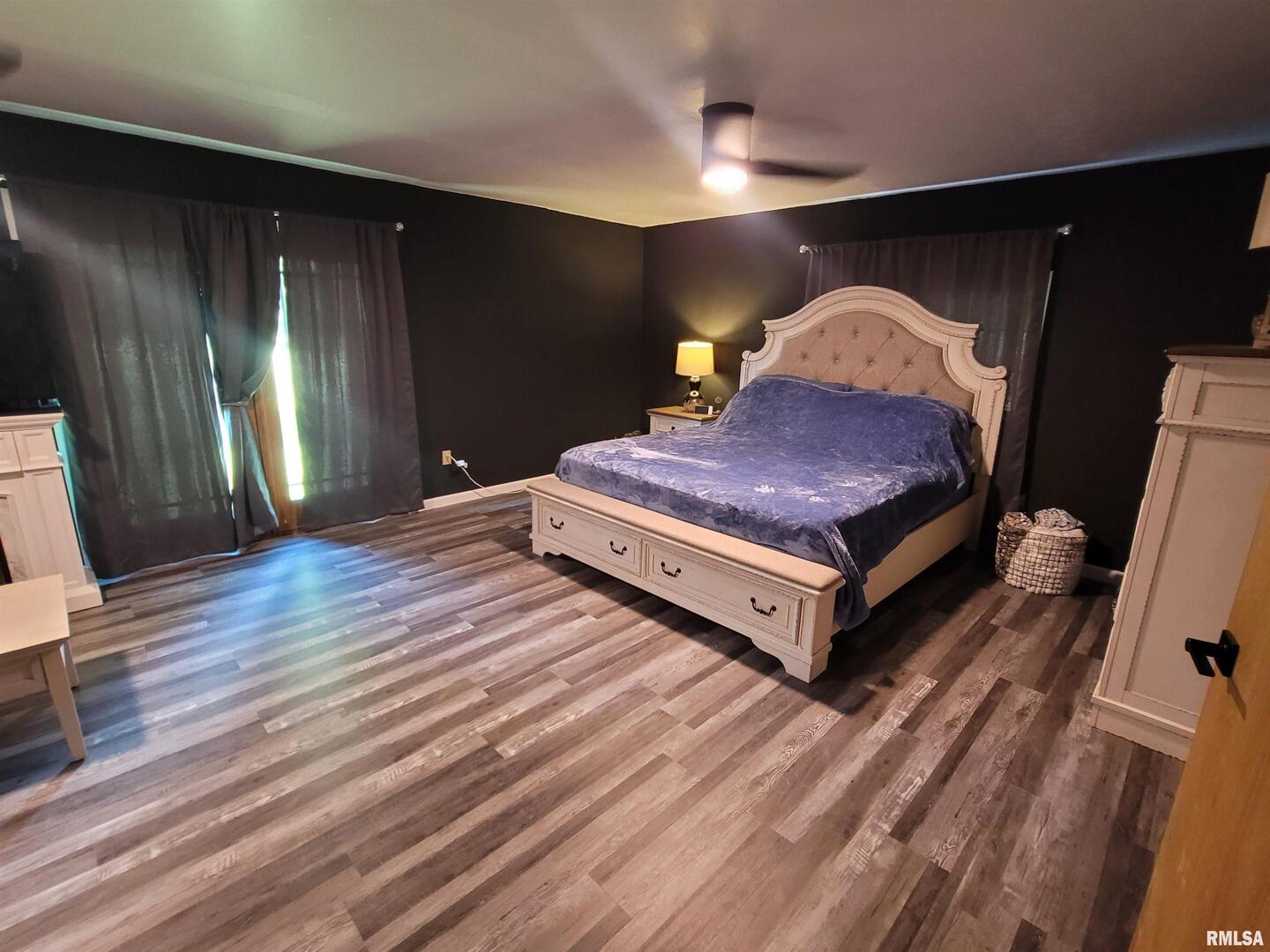 3993 Greenridge Road Alma, IL 62807 - Photo 19 of 45 a spacious bedroom with a bed and wooden floor