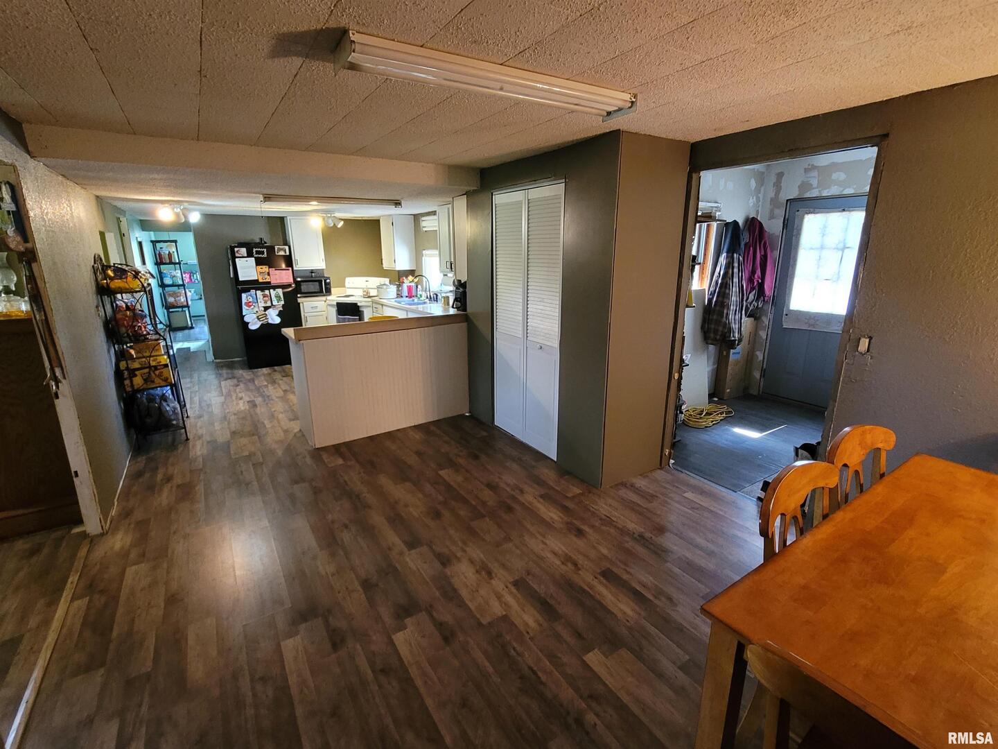 3993 Greenridge Road Alma, IL 62807 - Photo 10 of 45 a view of a livingroom with furniture wooden floor and a ceiling fan