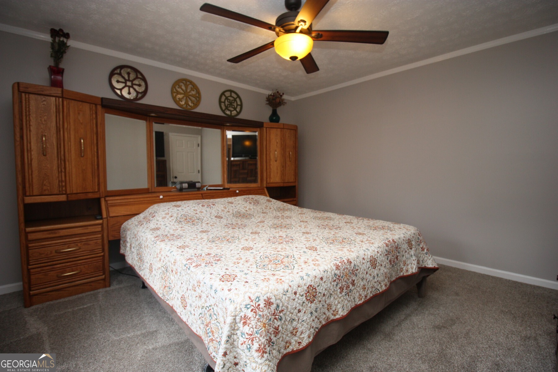 231 Murphy Road LaGrange, GA 30240 - Photo 14 of 24 a bedroom with a bed and a chandelier