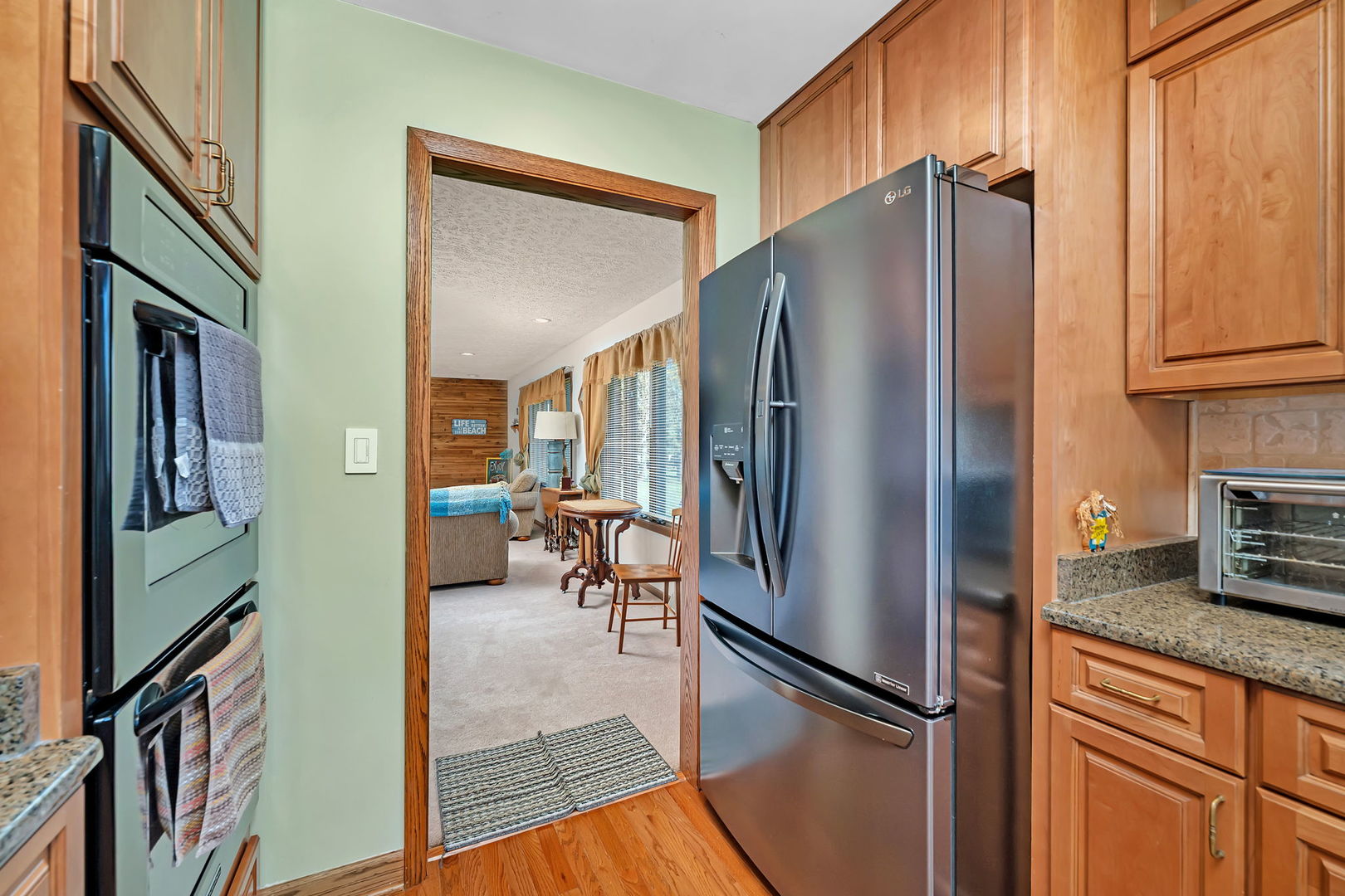 108 Deerpath Drive Minooka, IL 60447 - Photo 15 of 45 a kitchen with stainless steel appliances granite countertop a refrigerator and a stove