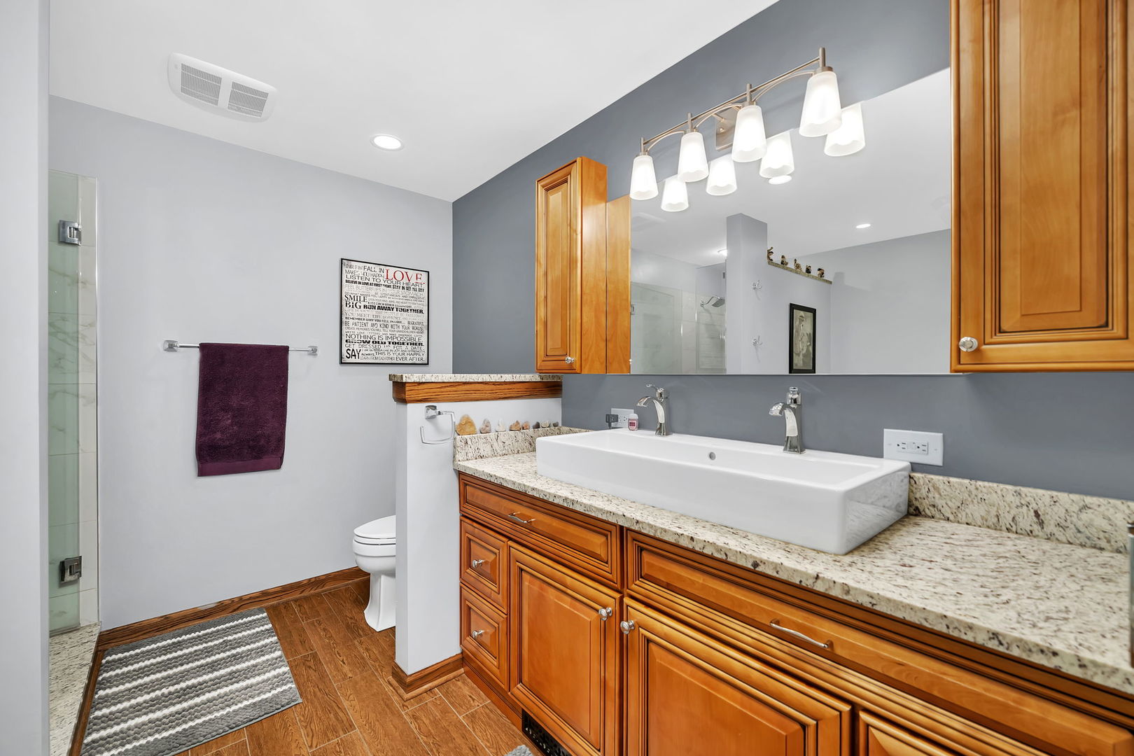 108 Deerpath Drive Minooka, IL 60447 - Photo 19 of 45 a bathroom with a sink a mirror and a toilet