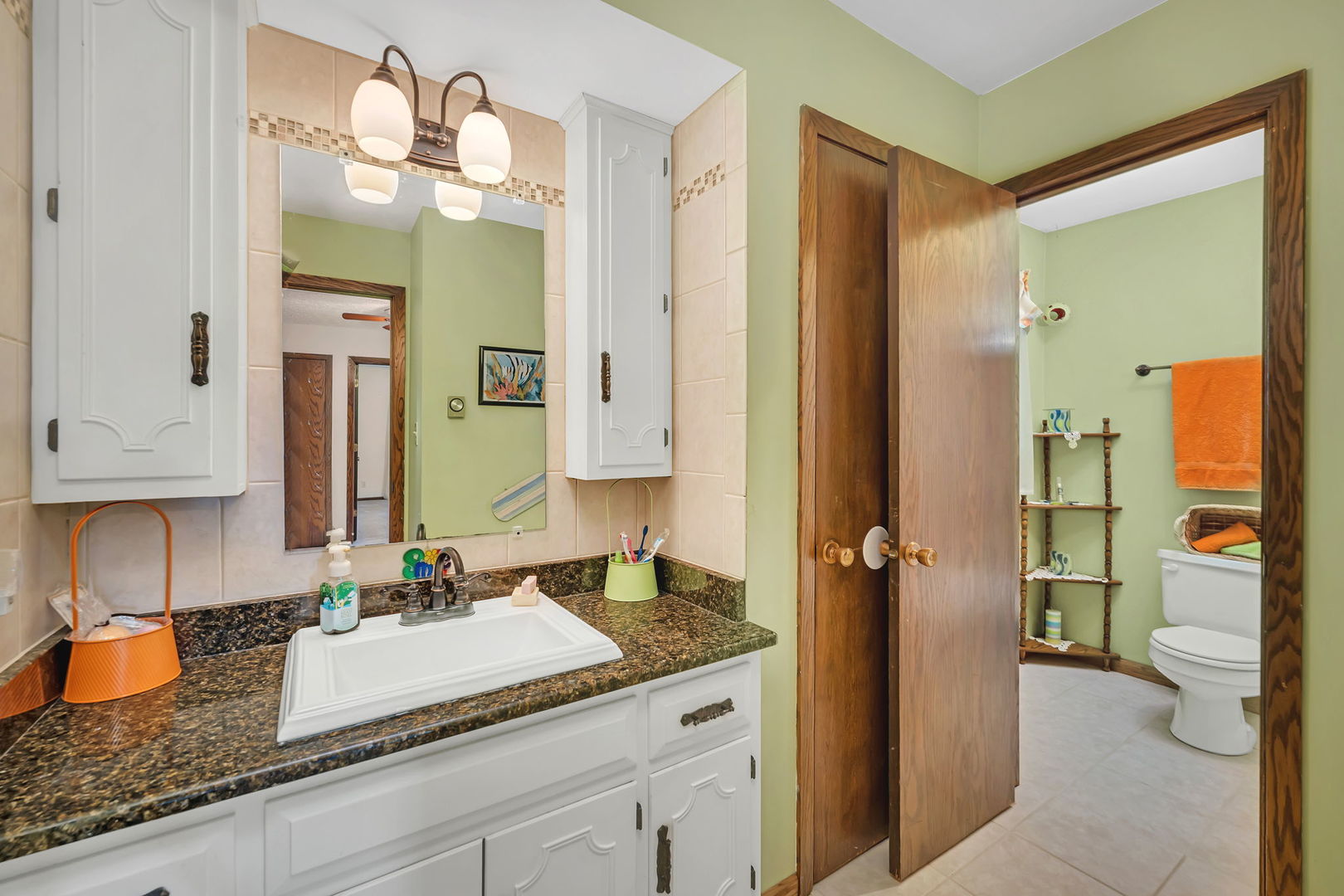 108 Deerpath Drive Minooka, IL 60447 - Photo 25 of 45 a bathroom with a granite countertop sink and a mirror