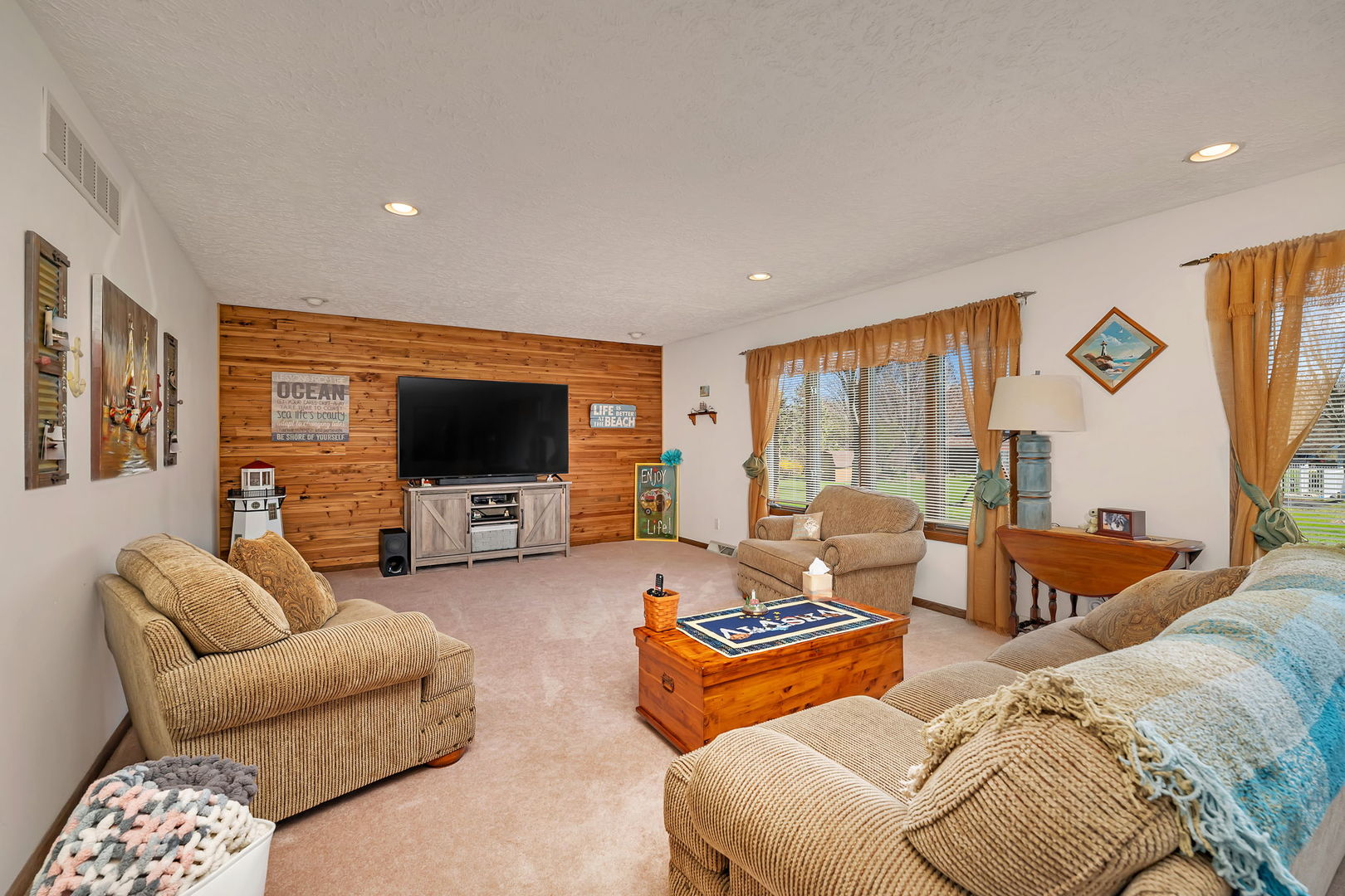 108 Deerpath Drive Minooka, IL 60447 - Photo 8 of 45 a living room with furniture and a flat screen tv