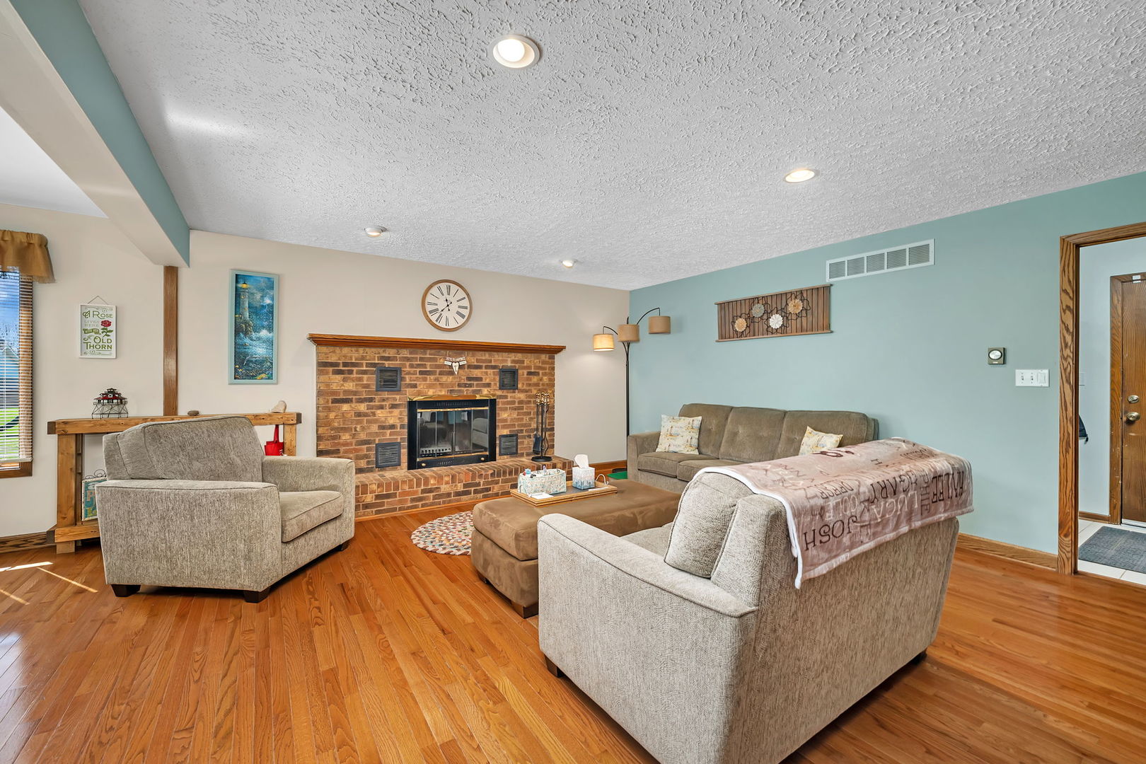 108 Deerpath Drive Minooka, IL 60447 - Photo 10 of 45 a living room with furniture and a fireplace