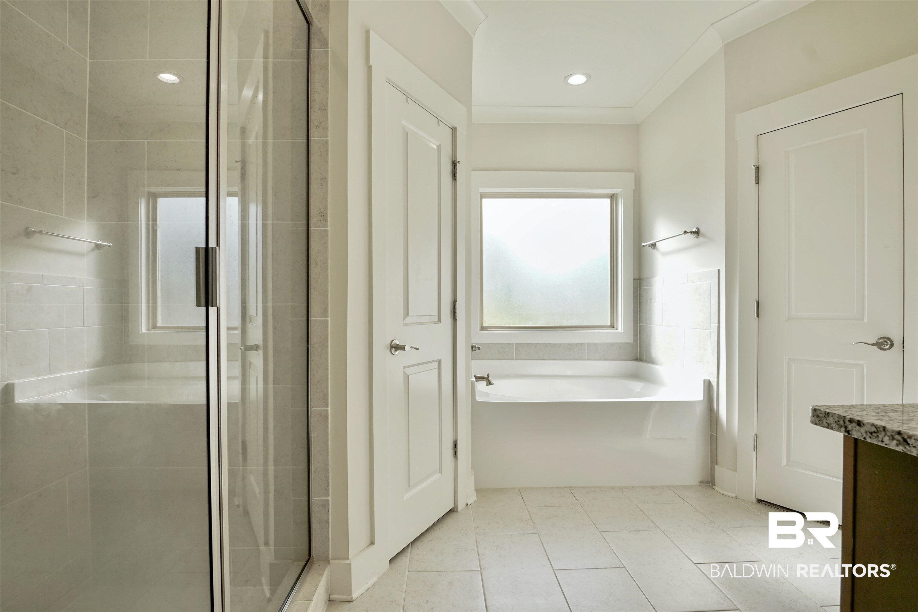 7090 Rocky Rd Loop Gulf Shores, AL 36542 - Photo 14 of 34 Full bathroom featuring tile patterned flooring, a shower stall, and a bath