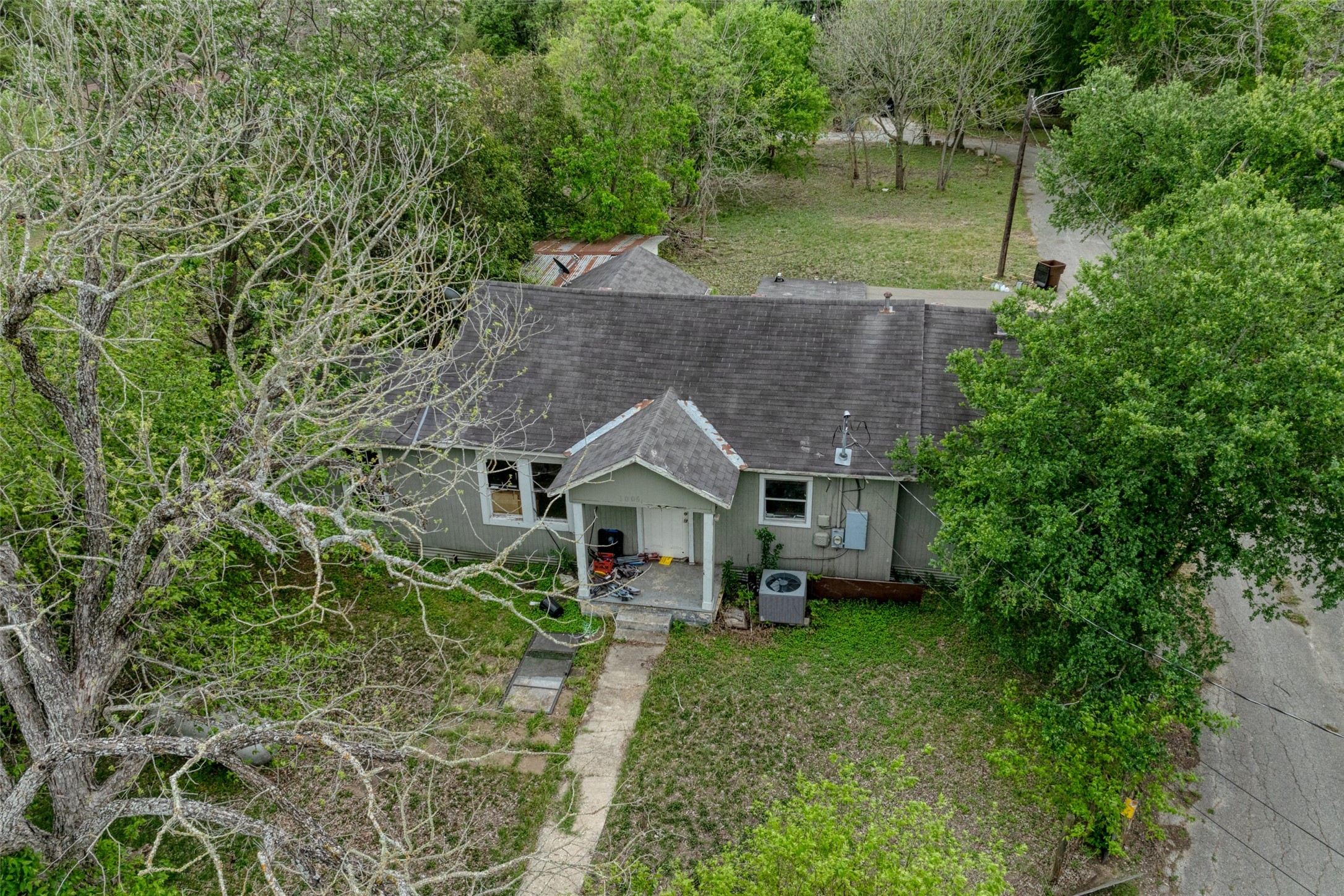 1006 Proctor Street Lockhart, TX 78644 - Photo 1 of 24 front view of a house with a yard