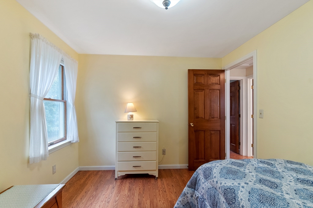 64 Apple Ridge Road West Springfield, MA 01089 - Photo 20 of 31 a bedroom with a bed and wooden floor