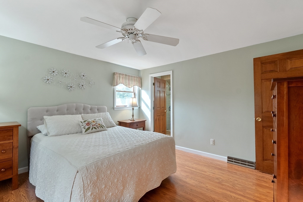 64 Apple Ridge Road West Springfield, MA 01089 - Photo 23 of 31 a bedroom with a large bed and a chandelier