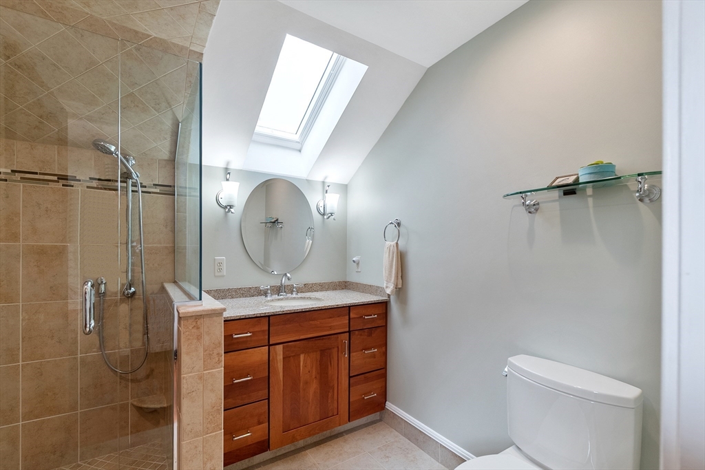 64 Apple Ridge Road West Springfield, MA 01089 - Photo 25 of 31 a bathroom with a granite countertop sink a toilet and a mirror
