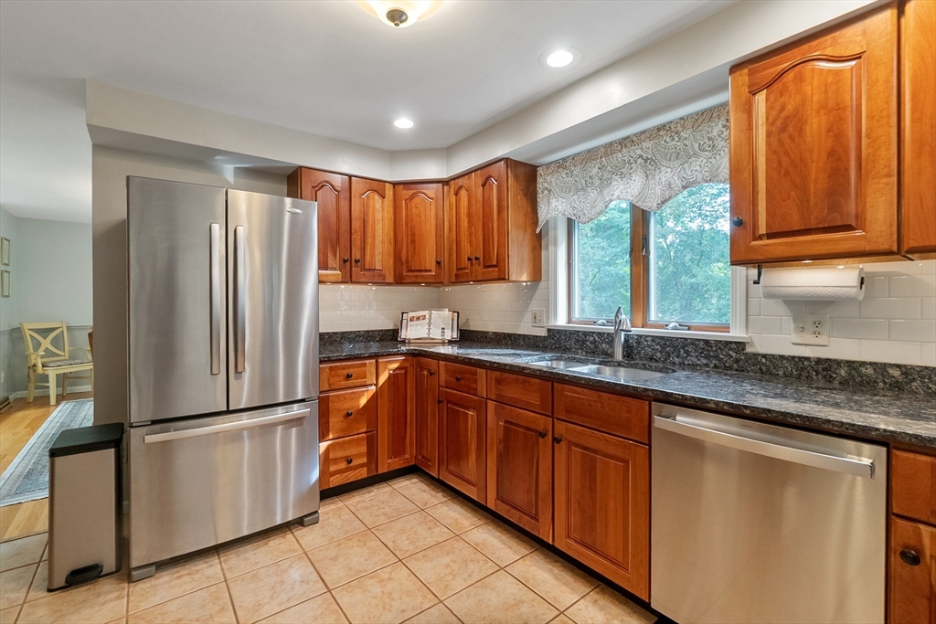 64 Apple Ridge Road West Springfield, MA 01089 - Photo 10 of 31 a kitchen with granite countertop stainless steel appliances a refrigerator sink and cabinets