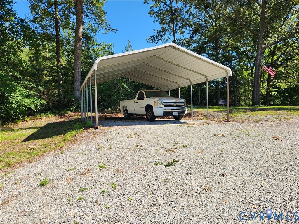 1448 Canterbury Road St. Stephens Church, VA 23148 - Photo 48 of 57 Gravel driveway offering a metal carport structure