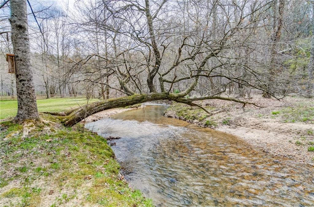 867 River Bend Road Ellijay, GA 30540 - Photo 1 of 1 Wide rushing creek surrounding the property