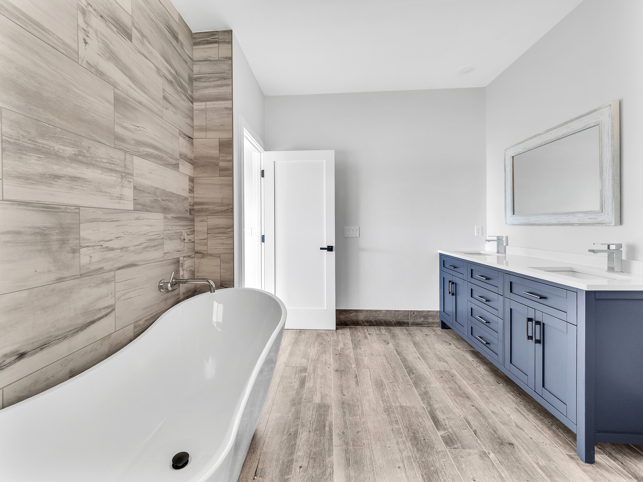 94-1549 Ha'Eha'e Street Naalehu, HI 96772 - Photo 18 of 30 a bathroom with a granite countertop bathtub sink vanity and mirror