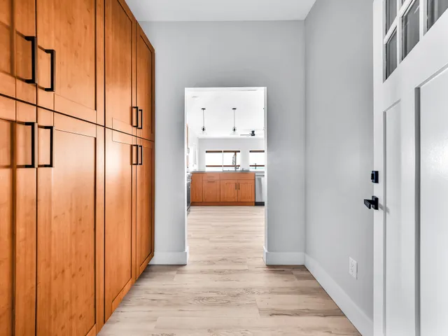 a view of hallway with livingroom and furniture