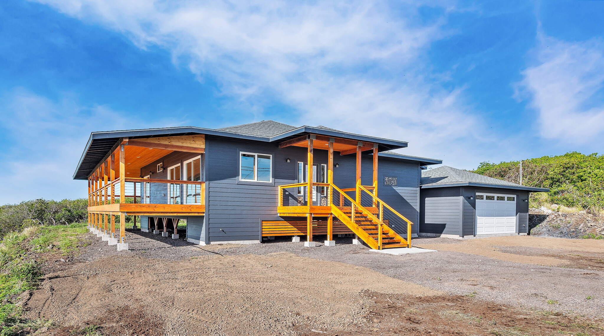 94-1549 Ha'Eha'e Street Naalehu, HI 96772 - Photo 4 of 30 a backyard of a house with table and chairs