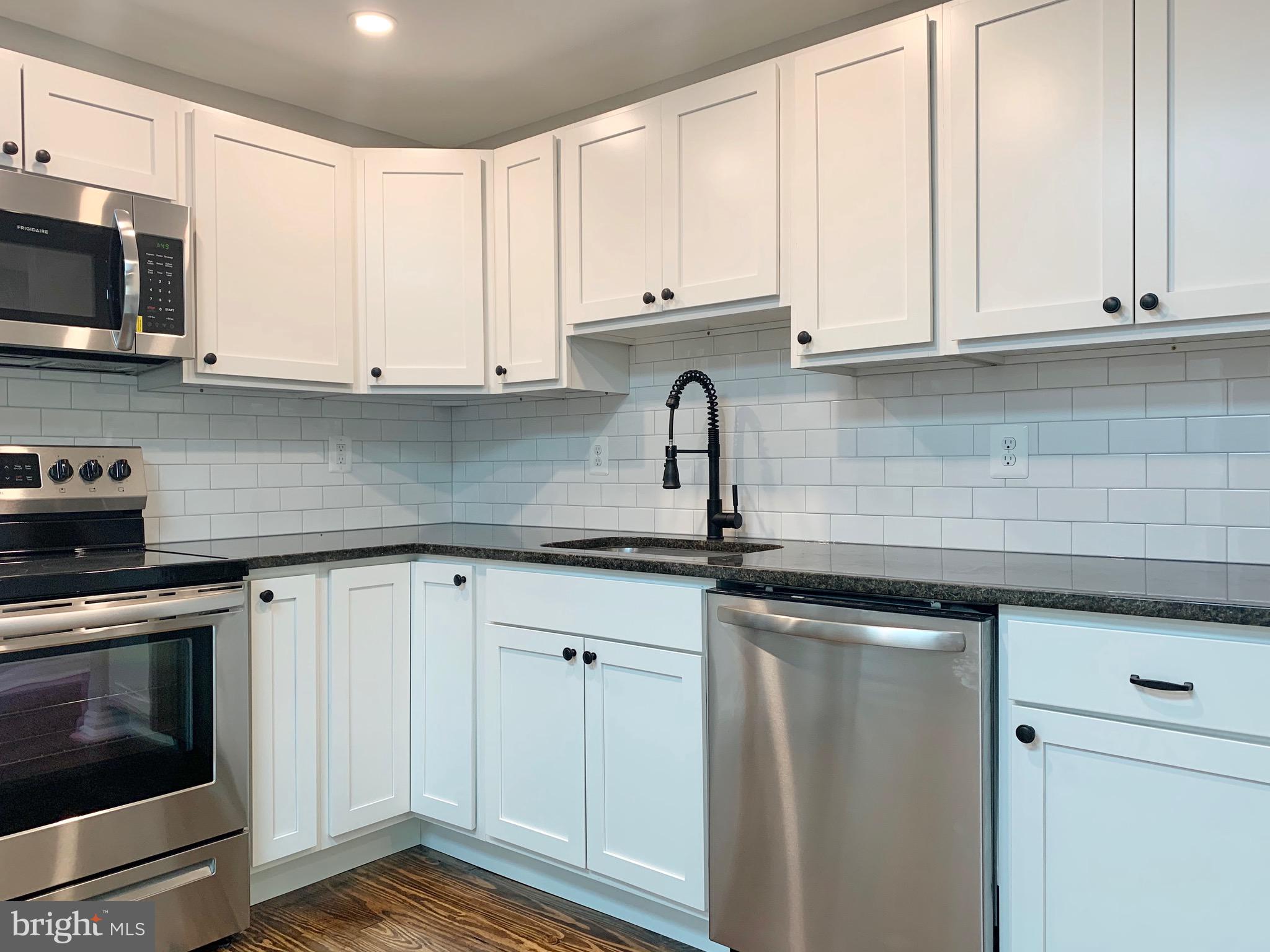 Fresh subway tile backsplash and fixtures