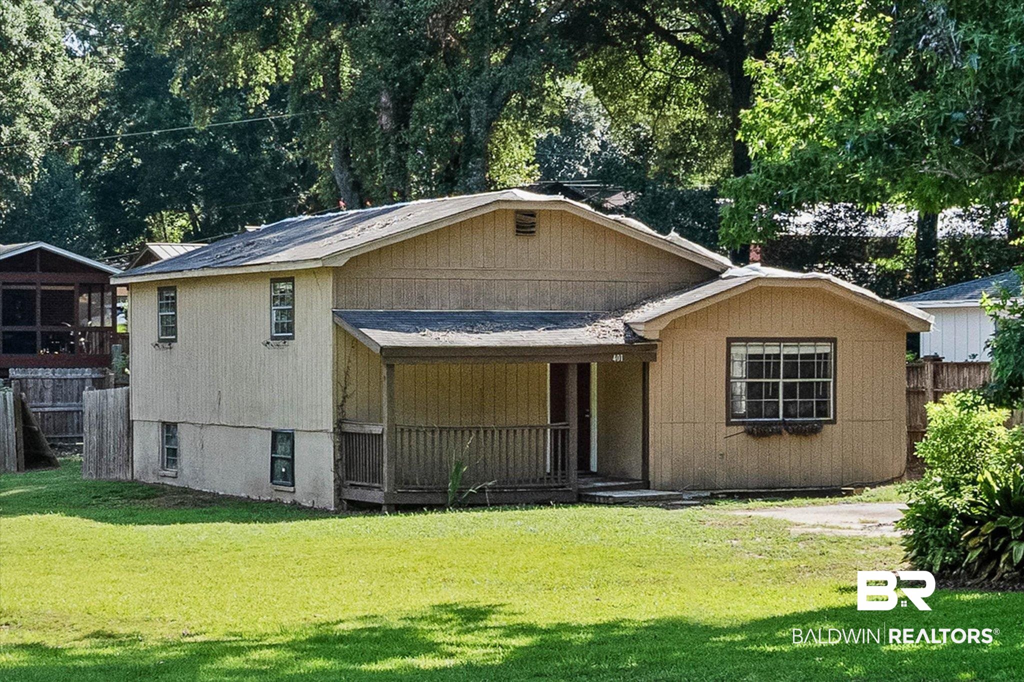 401 Frederick Avenue Fairhope, AL 36532 - Photo 1 of 36 Single-family residence featuring wood-paneled siding and a covered front porch