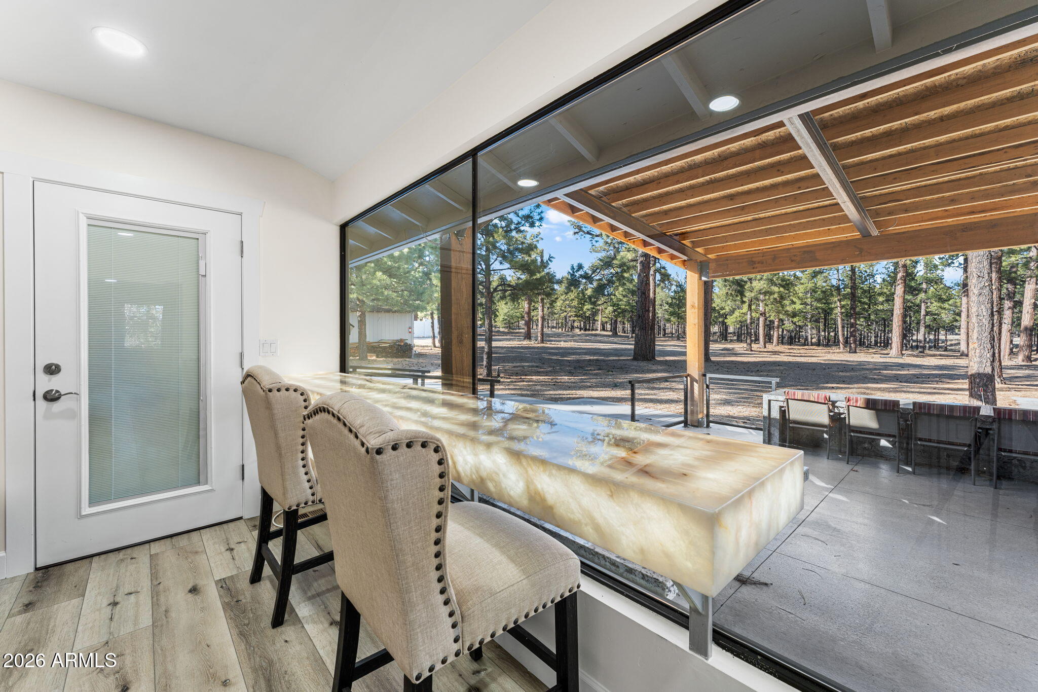 5055 Townsend-Winona Road Flagstaff, AZ 86004 - Photo 5 of 34 a dining room with furniture and large windows