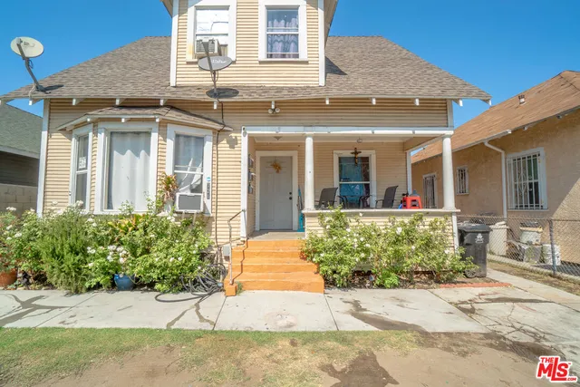 a view of a building with potted plants