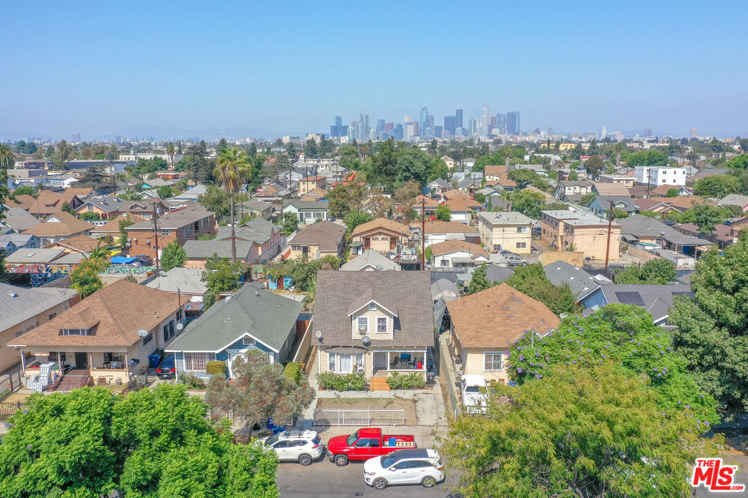 721 East 42nd Place Los Angeles, CA 90011 - Photo 7 of 8 an aerial view of residential houses with city view