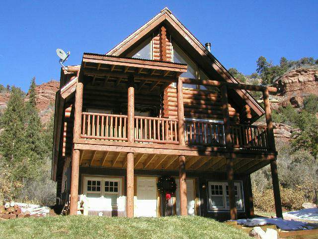 48 Redcliff Road Telluride, CO 81435 - Photo 4 of 4 a front view of a house with a yard