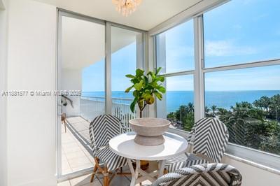 609 Ocean Drive, Unit 8G Key Biscayne, FL 33149 - Photo 12 of 44 a view of a dining room with furniture window and flowerpot
