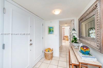 609 Ocean Drive, Unit 8G Key Biscayne, FL 33149 - Photo 14 of 44 a room with furniture and chandelier