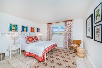 609 Ocean Drive, Unit 8G Key Biscayne, FL 33149 - Photo 24 of 44 a bedroom with a bed and a window