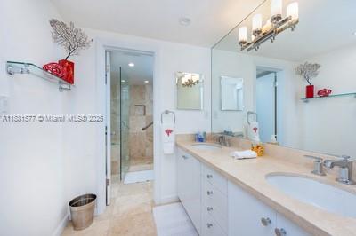 609 Ocean Drive, Unit 8G Key Biscayne, FL 33149 - Photo 26 of 44 a bathroom with a sink vanity granite shower and a mirror