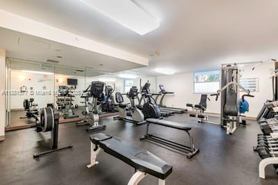 609 Ocean Drive, Unit 8G Key Biscayne, FL 33149 - Photo 28 of 44 a view of a room with gym equipment