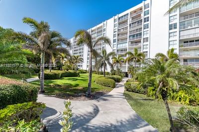 609 Ocean Drive, Unit 8G Key Biscayne, FL 33149 - Photo 29 of 44 a view of a garden with a pathway